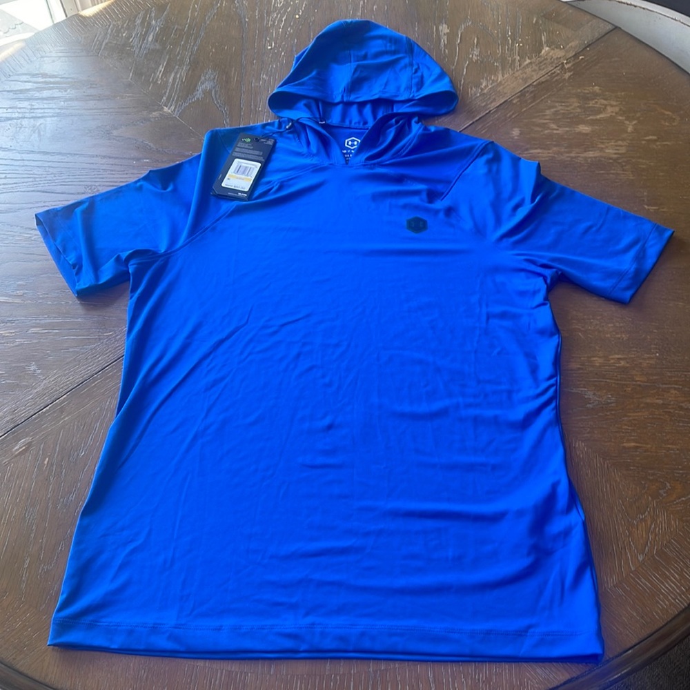 Under armour rush short sleeve hooded shirt. Material is polyester.
